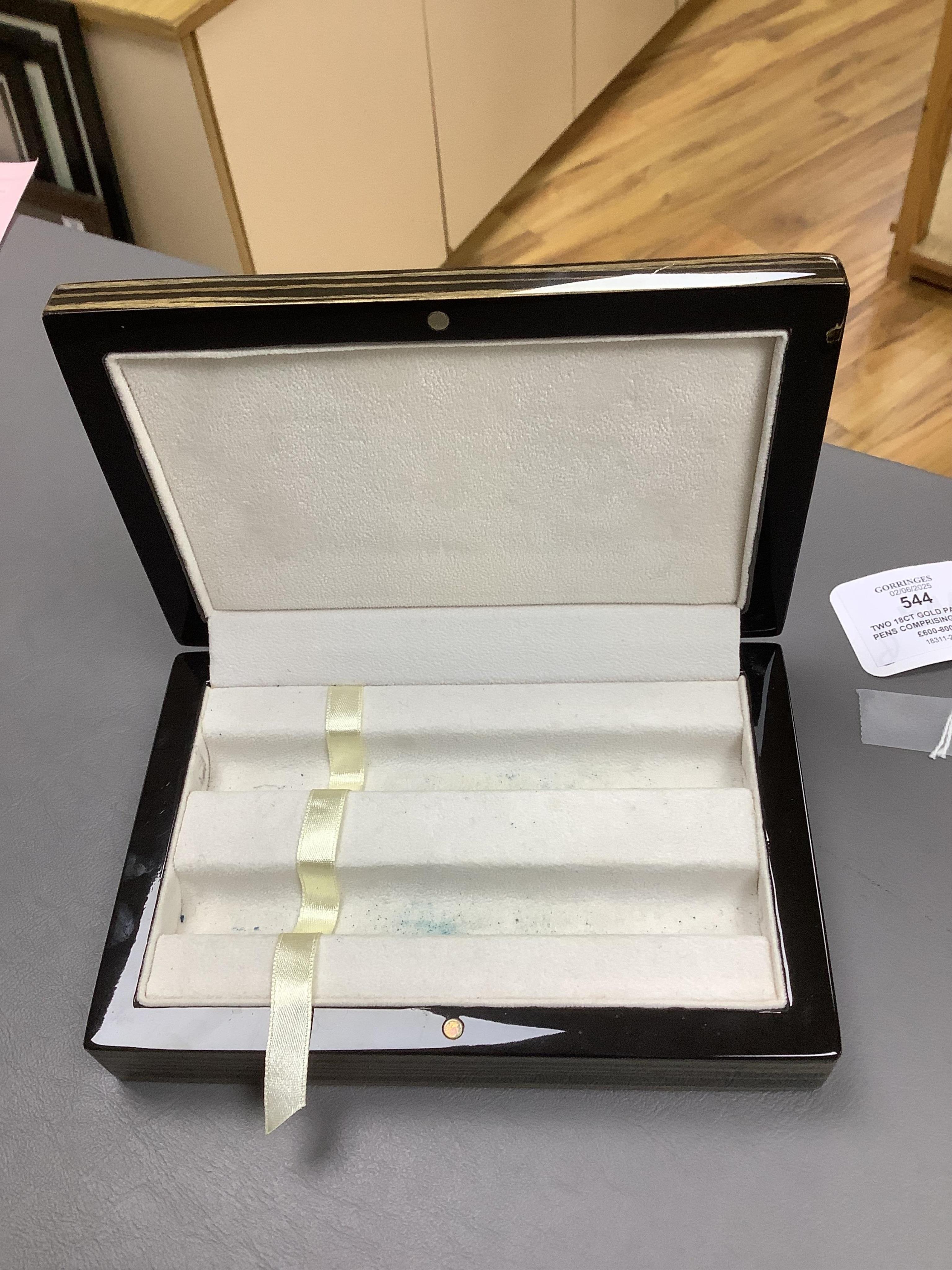Two 18ct gold Parker pens comprising a propelling pencil and fountain pen, cased